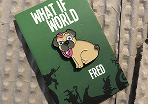 Enamel pin of Fred the Dog.